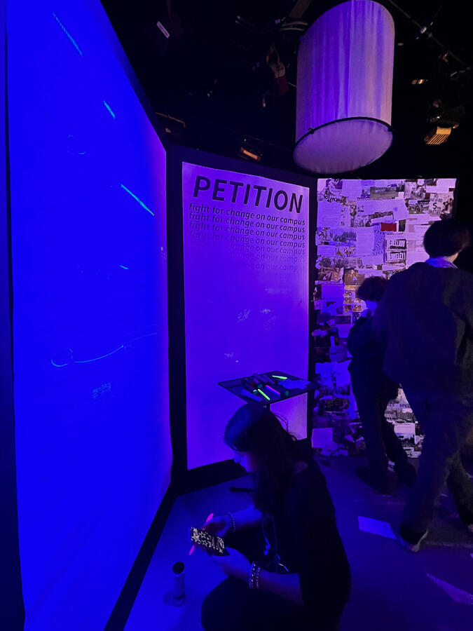 The left side of the room contained an annotated letter from the president, a petition, and a media collage.